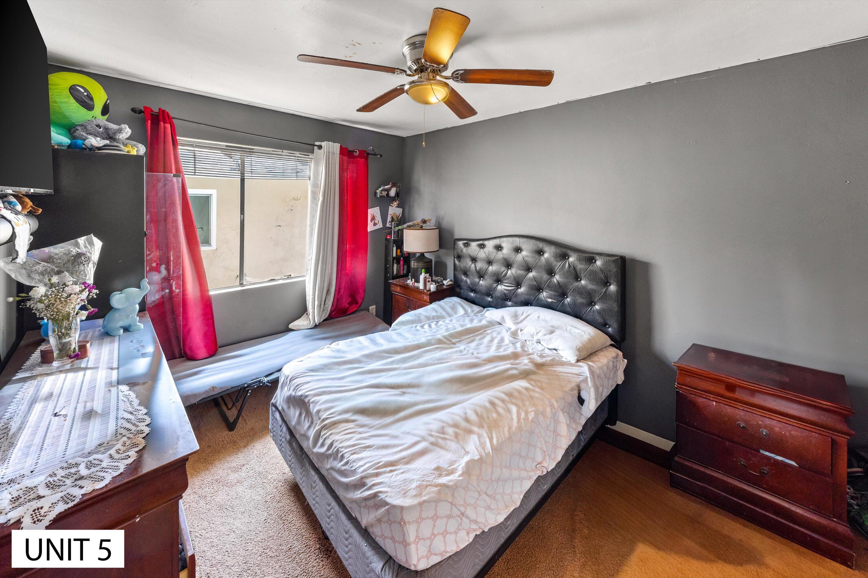 5859 Mandarin Drive Santa Barbara, CA 93117 - Photo 41 of 55 a bedroom with a bed and a chandelier