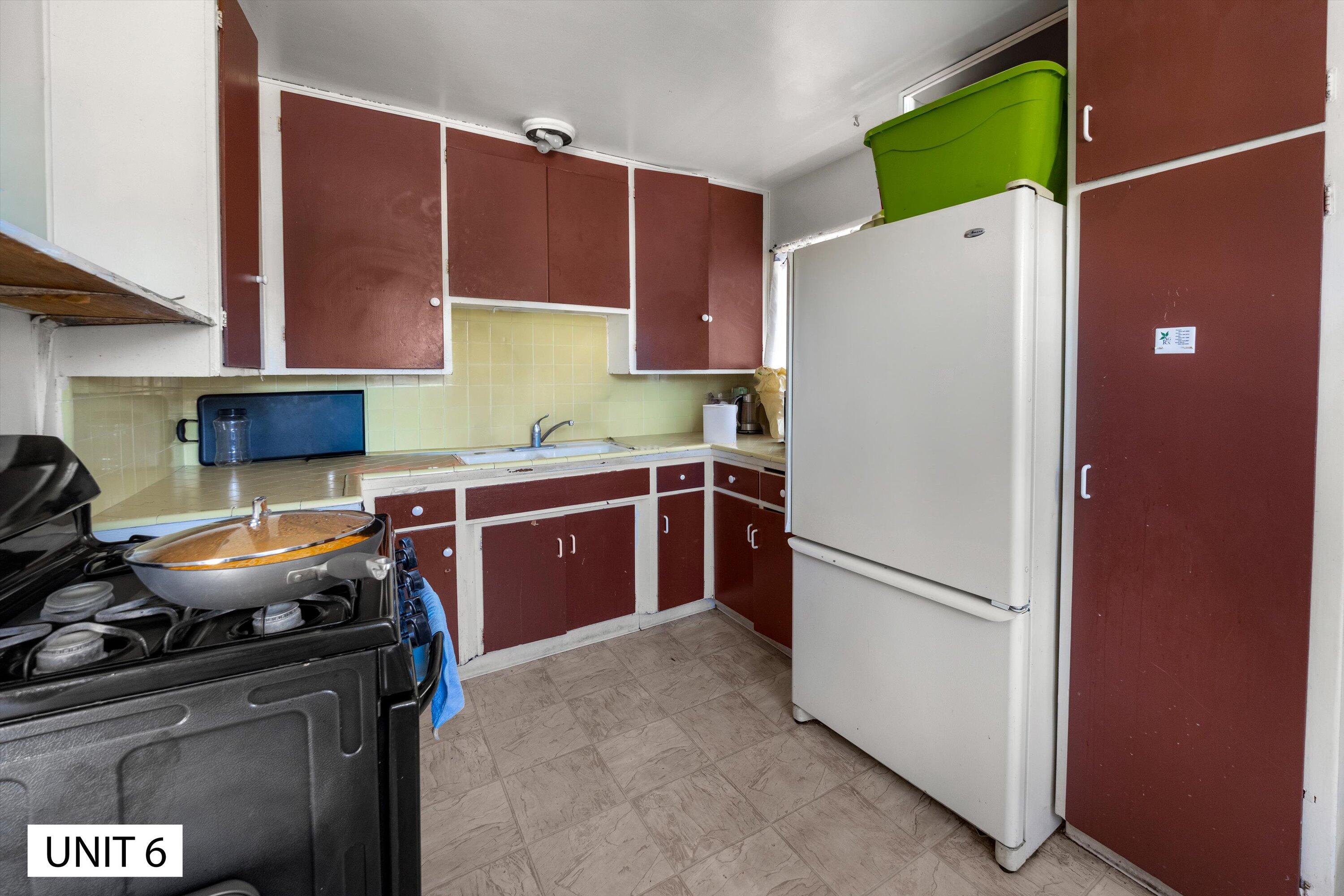 5859 Mandarin Drive Santa Barbara, CA 93117 - Photo 44 of 55 a kitchen with a refrigerator and a stove
