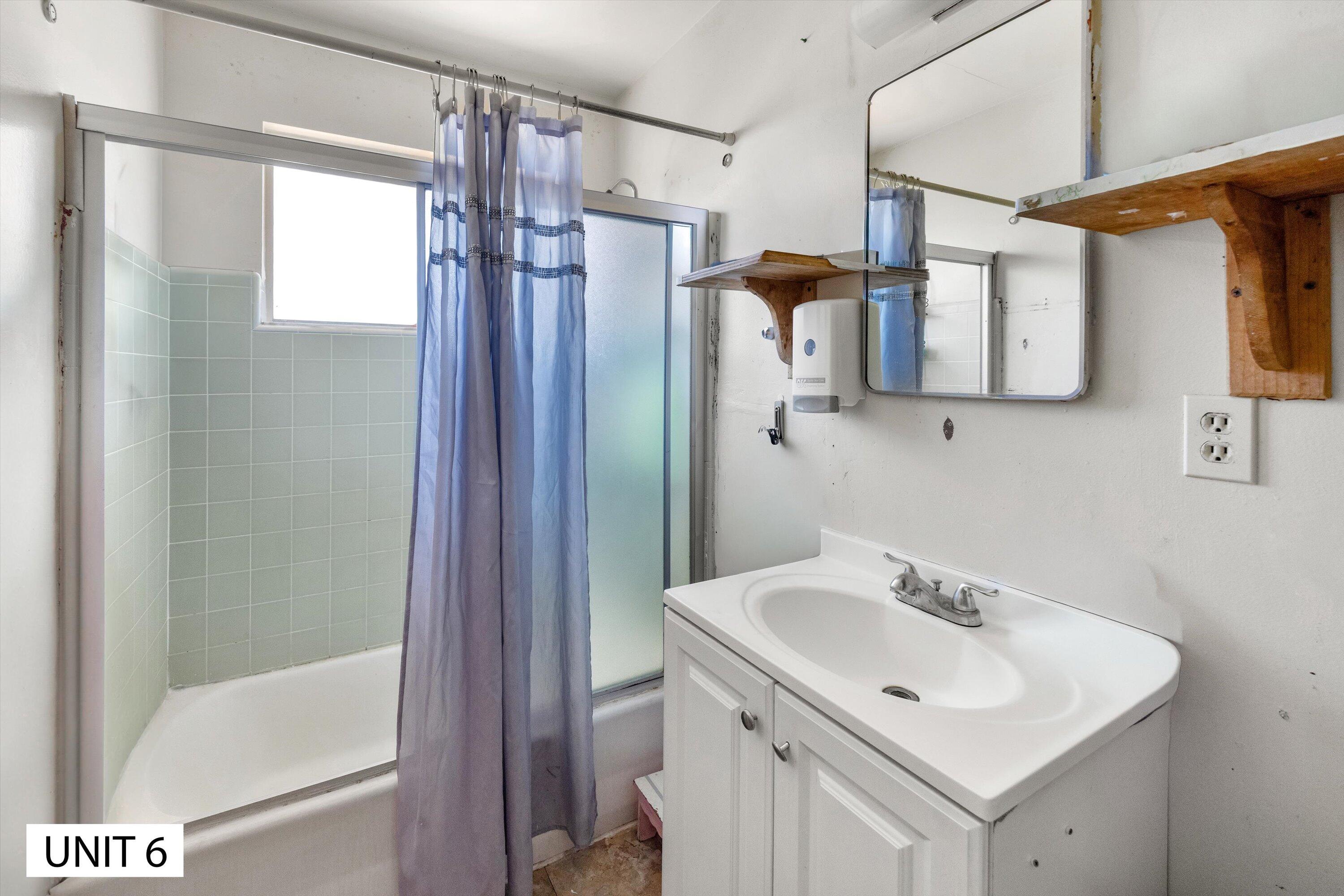 5859 Mandarin Drive Santa Barbara, CA 93117 - Photo 45 of 55 a bathroom with a sink and mirror with bathtub