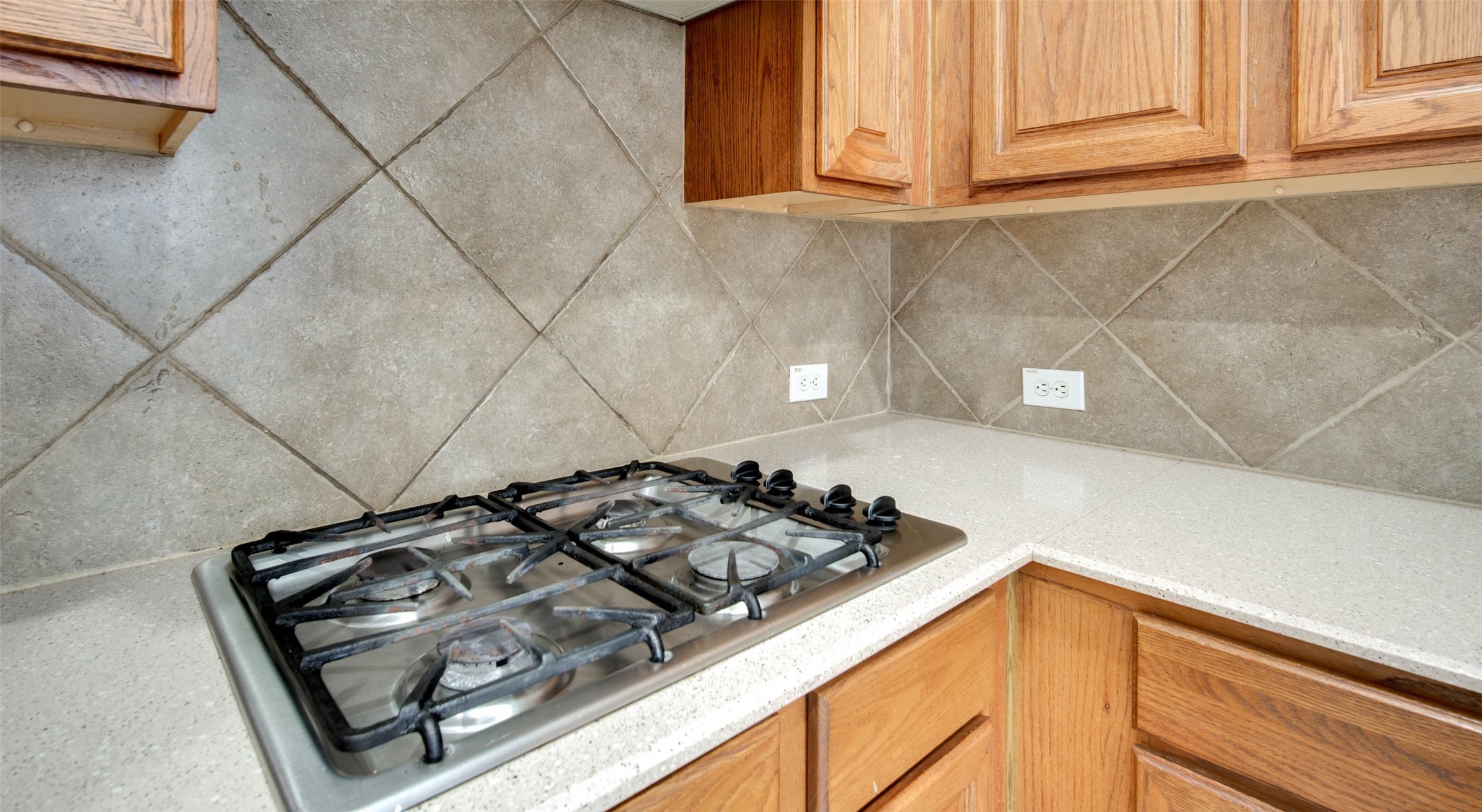 9323 Hillhaven Court Rosenberg, TX 77469 - Photo 12 of 37 a kitchen with a stove a microwave and cabinets
