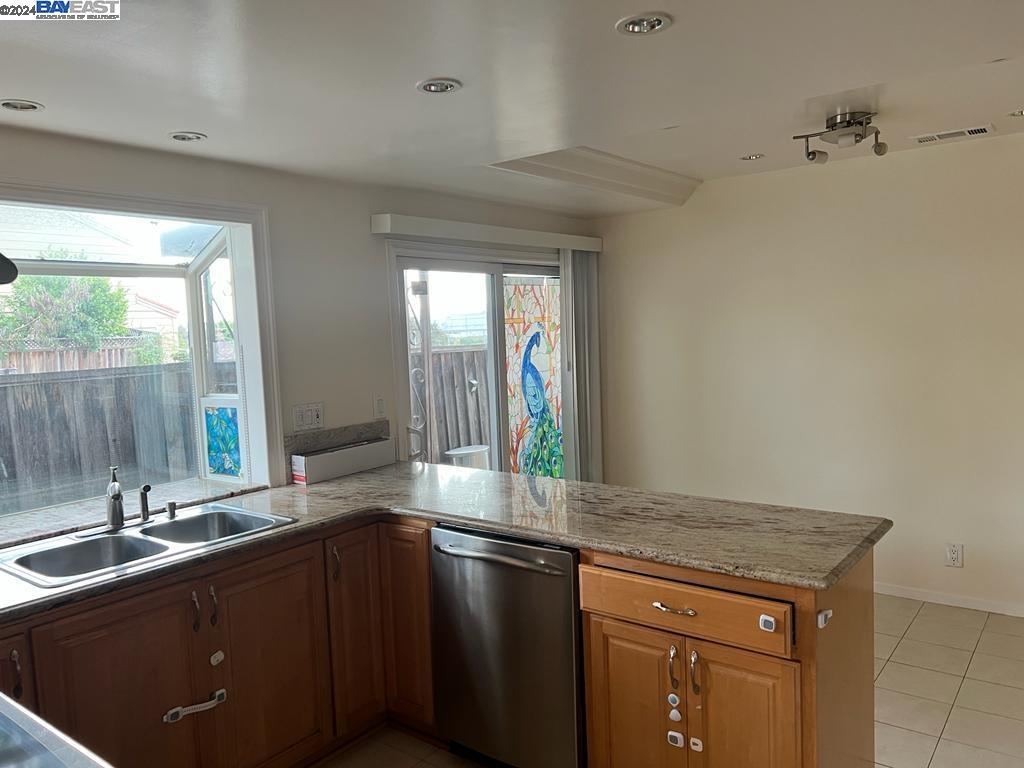 1064 Dempsey Road Milpitas, CA 95035 - Photo 12 of 31 a kitchen with a sink and large window