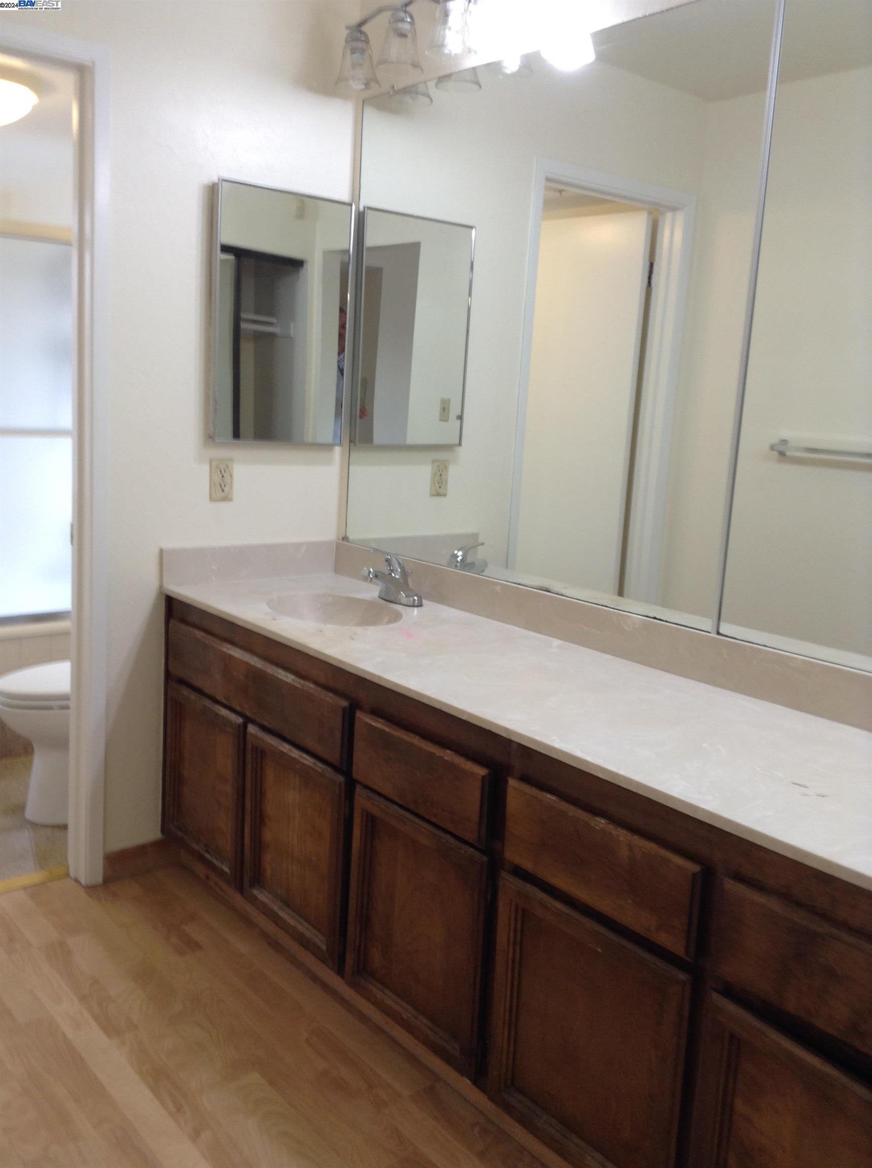 1064 Dempsey Road Milpitas, CA 95035 - Photo 20 of 31 a bathroom with a sink and a mirror