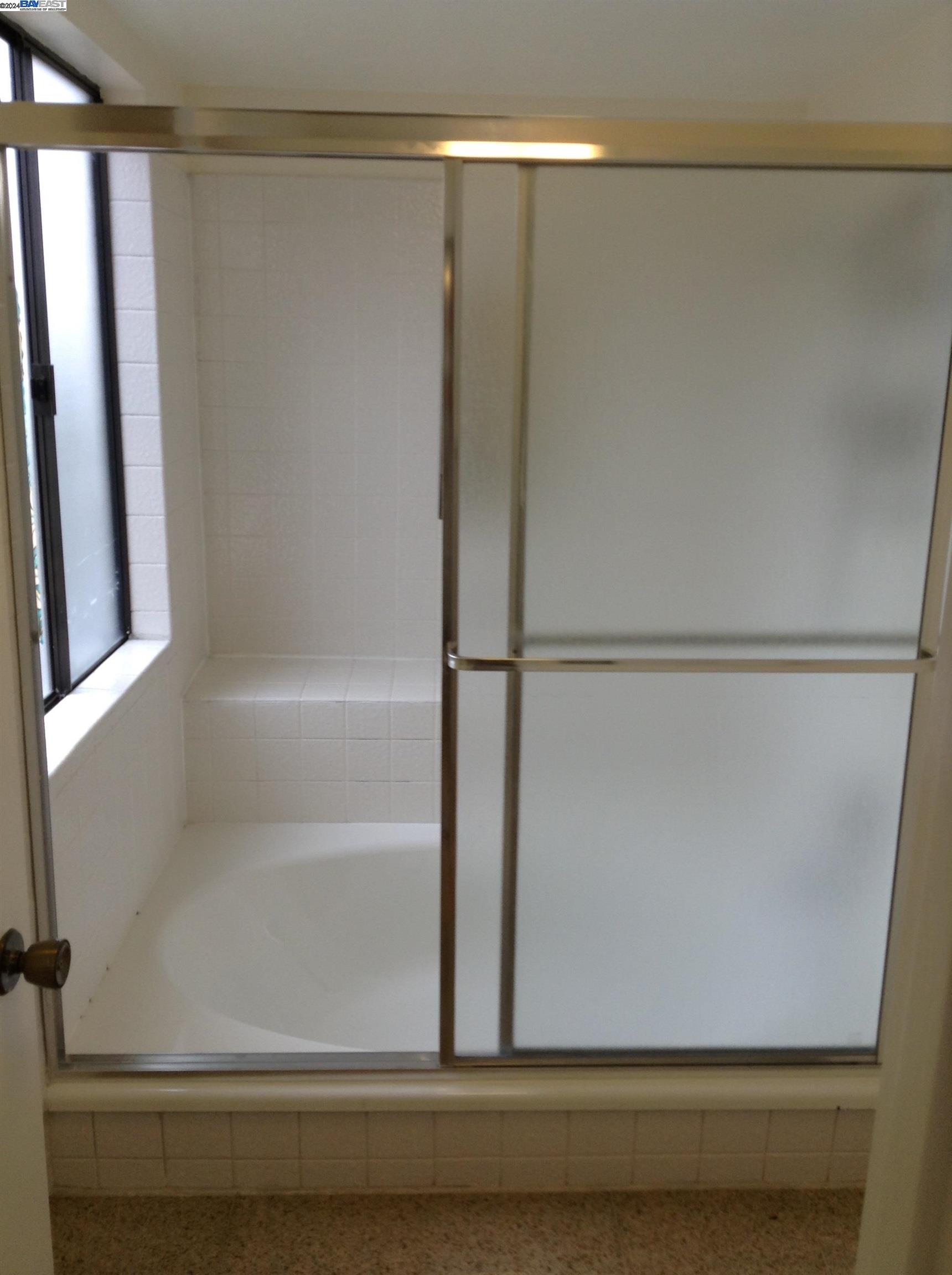 1064 Dempsey Road Milpitas, CA 95035 - Photo 24 of 31 a bathroom with a bathtub