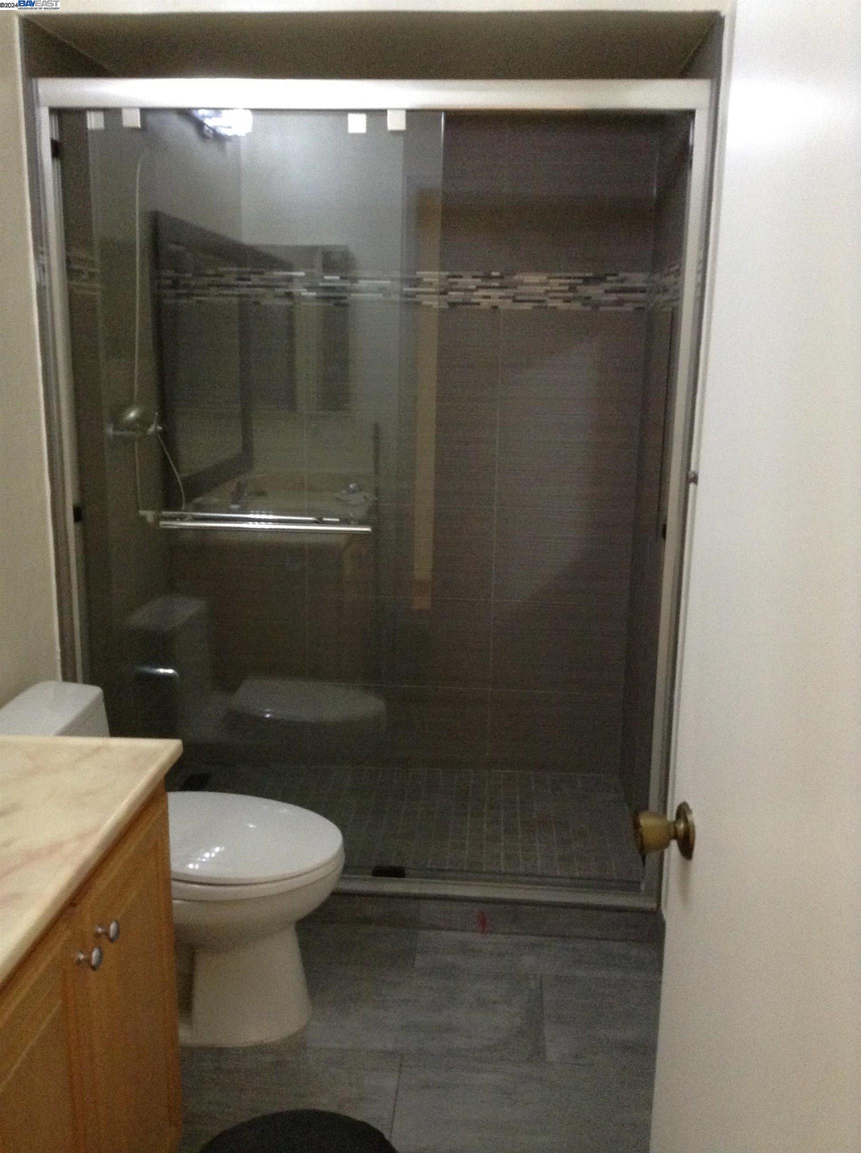 1064 Dempsey Road Milpitas, CA 95035 - Photo 26 of 31 a bathroom with a toilet and a shower