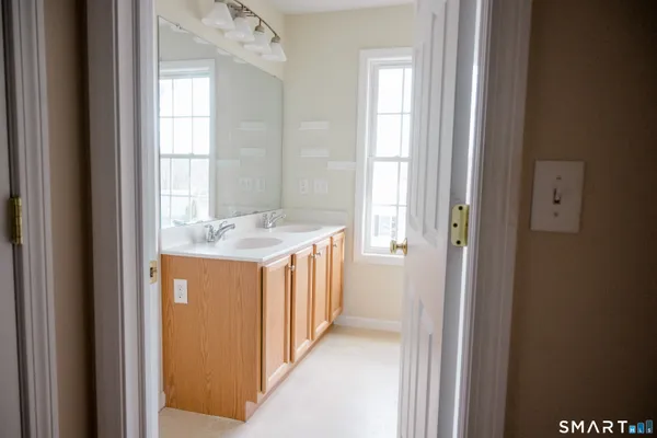 a view of a bathroom from a hallway