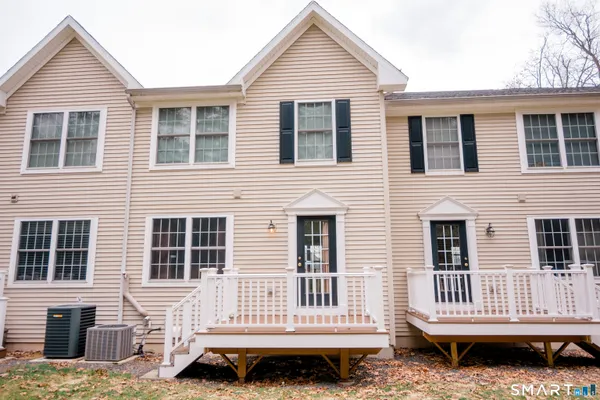 a backyard of a house with barbeque oven