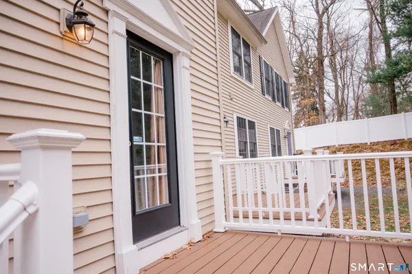 a view of a house with wooden deck