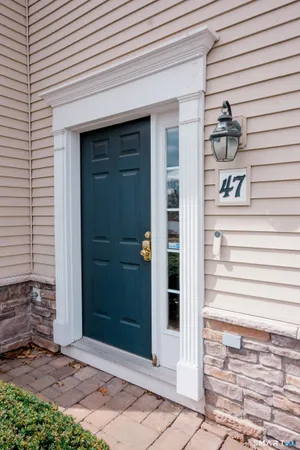 a view of a door and a window