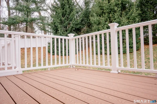 a view of entryway with wooden floor and fence