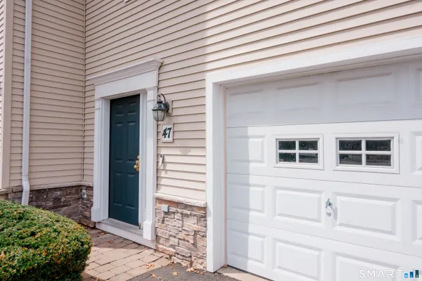 a front view of a house with a garage