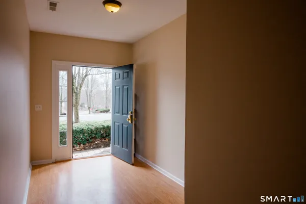 a view of entryway with wooden floor