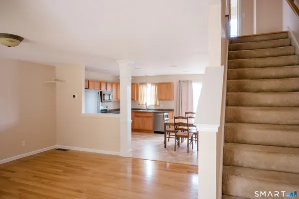 a view of a livingroom with furniture and wooden floor