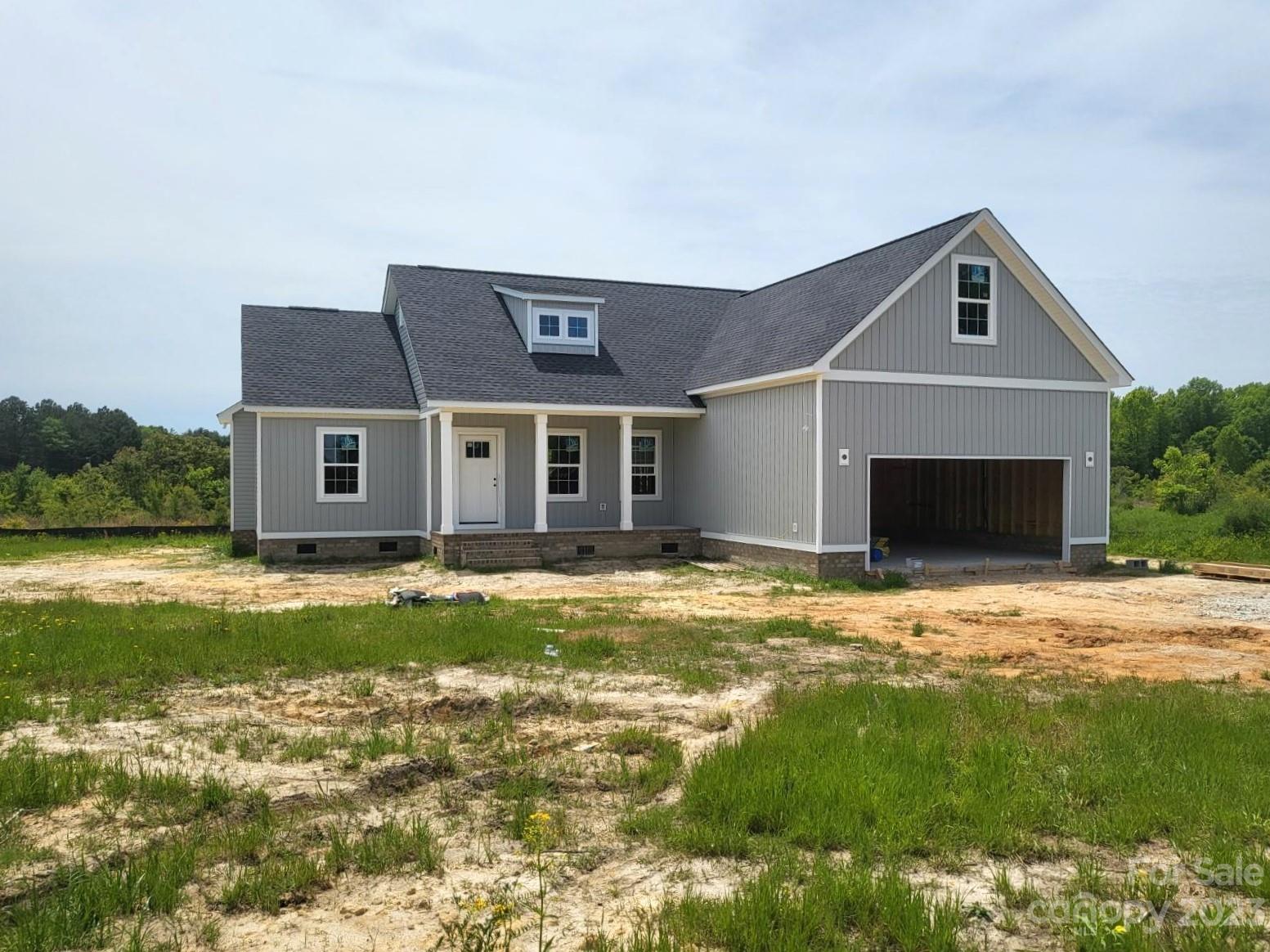 1322 Philbeck Road York, SC 29745 - Photo 1 of 3 a front view of a house with a yard