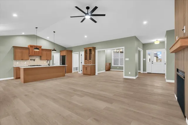 a view of kitchen with cabinets and wooden floor