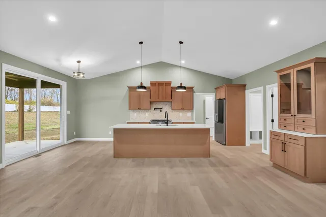 a view of a kitchen with a sink and cabinets
