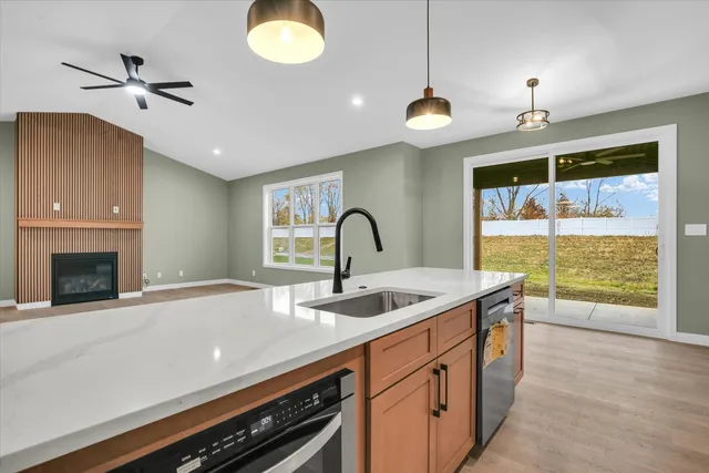 a kitchen with a stove and a large window