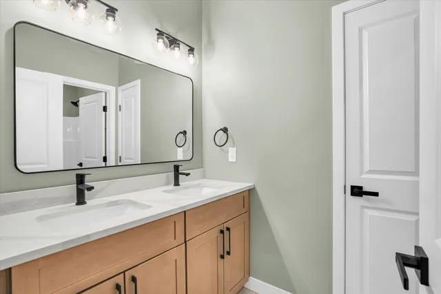 a bathroom with a sink and a mirror