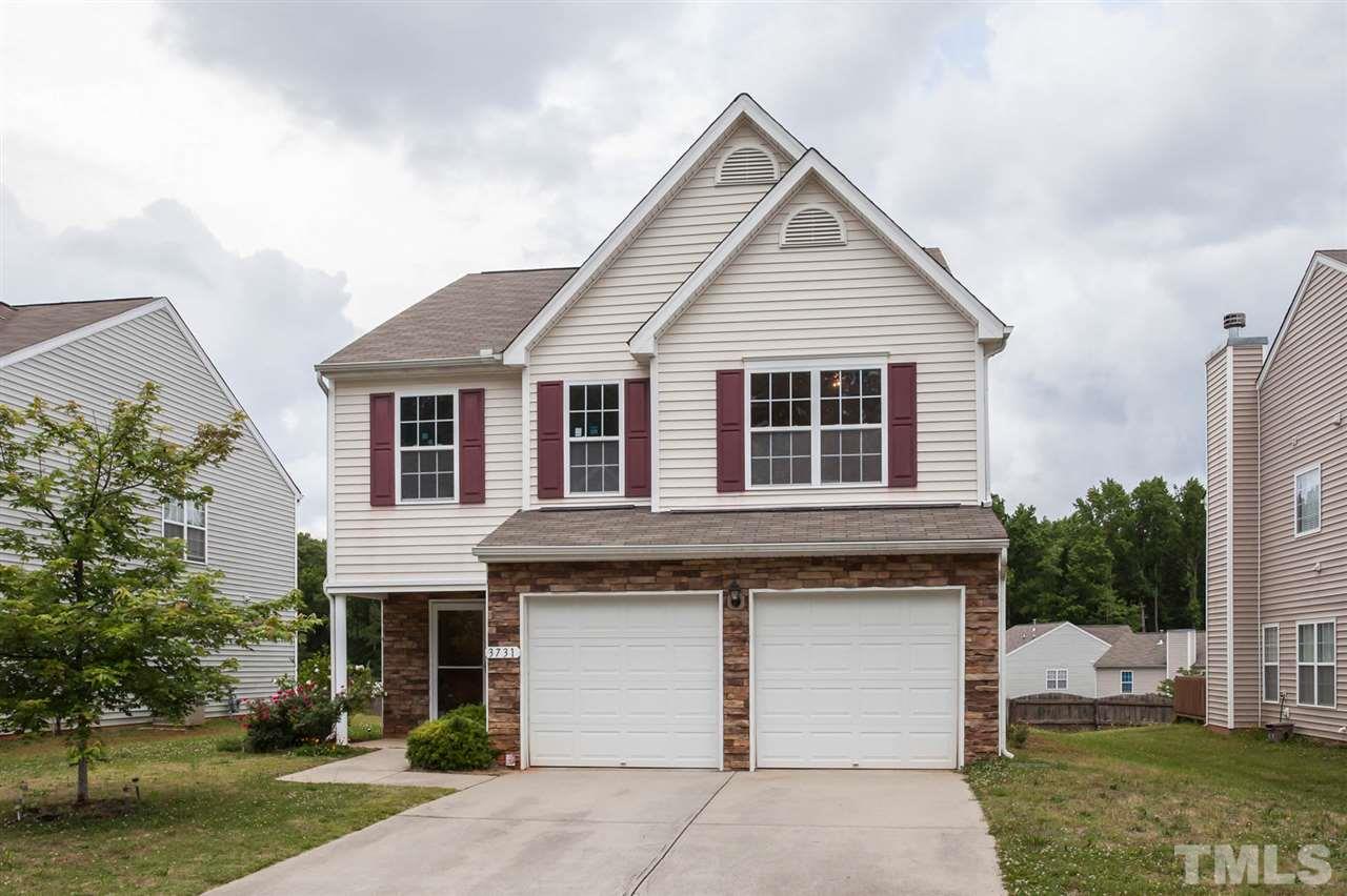 3731 Burtons Barn Street Raleigh, NC 27610 - Photo 1 of 13 a view of a white house with a yard and plants