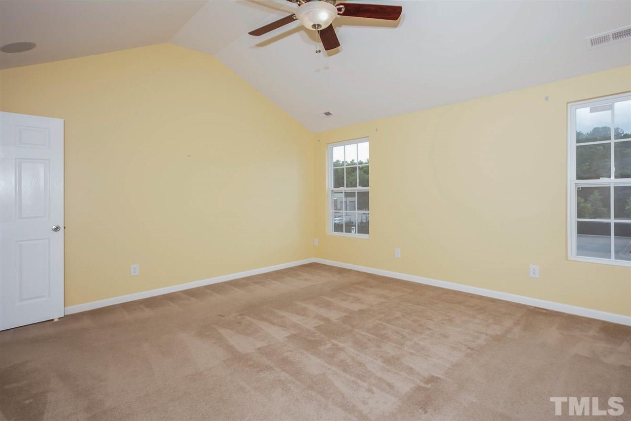 3731 Burtons Barn Street Raleigh, NC 27610 - Photo 6 of 13 an empty room with windows and fan