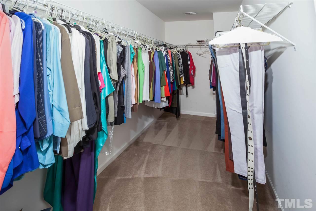3731 Burtons Barn Street Raleigh, NC 27610 - Photo 9 of 13 a view of walk in closet with clothes