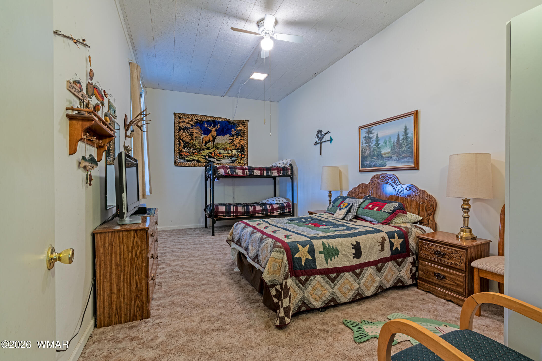 2116 Marble Road Clay Springs, AZ 85923 - Photo 34 of 48 a bedroom with bed and a chandelier