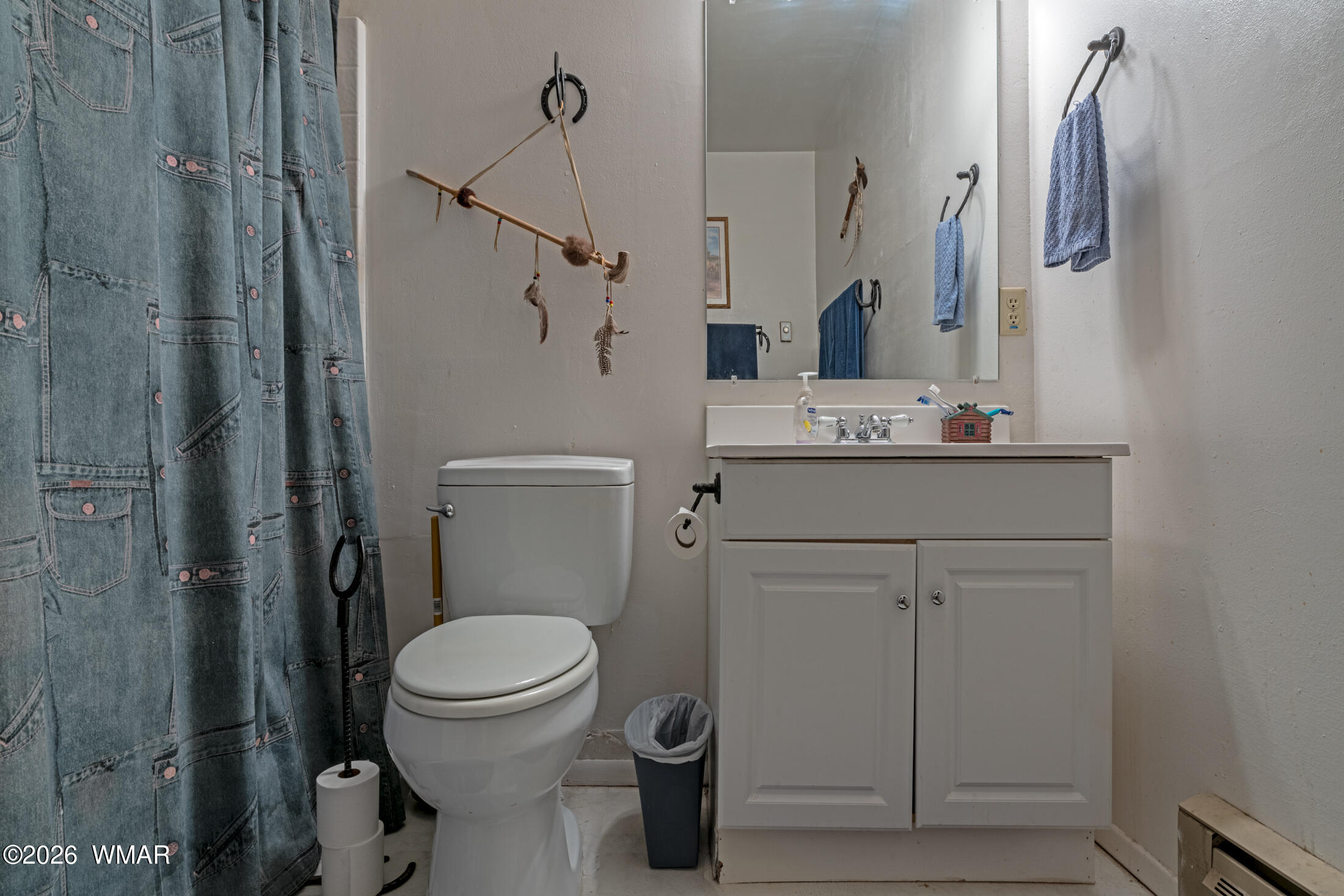 2116 Marble Road Clay Springs, AZ 85923 - Photo 36 of 48 a bathroom with a toilet sink and mirror