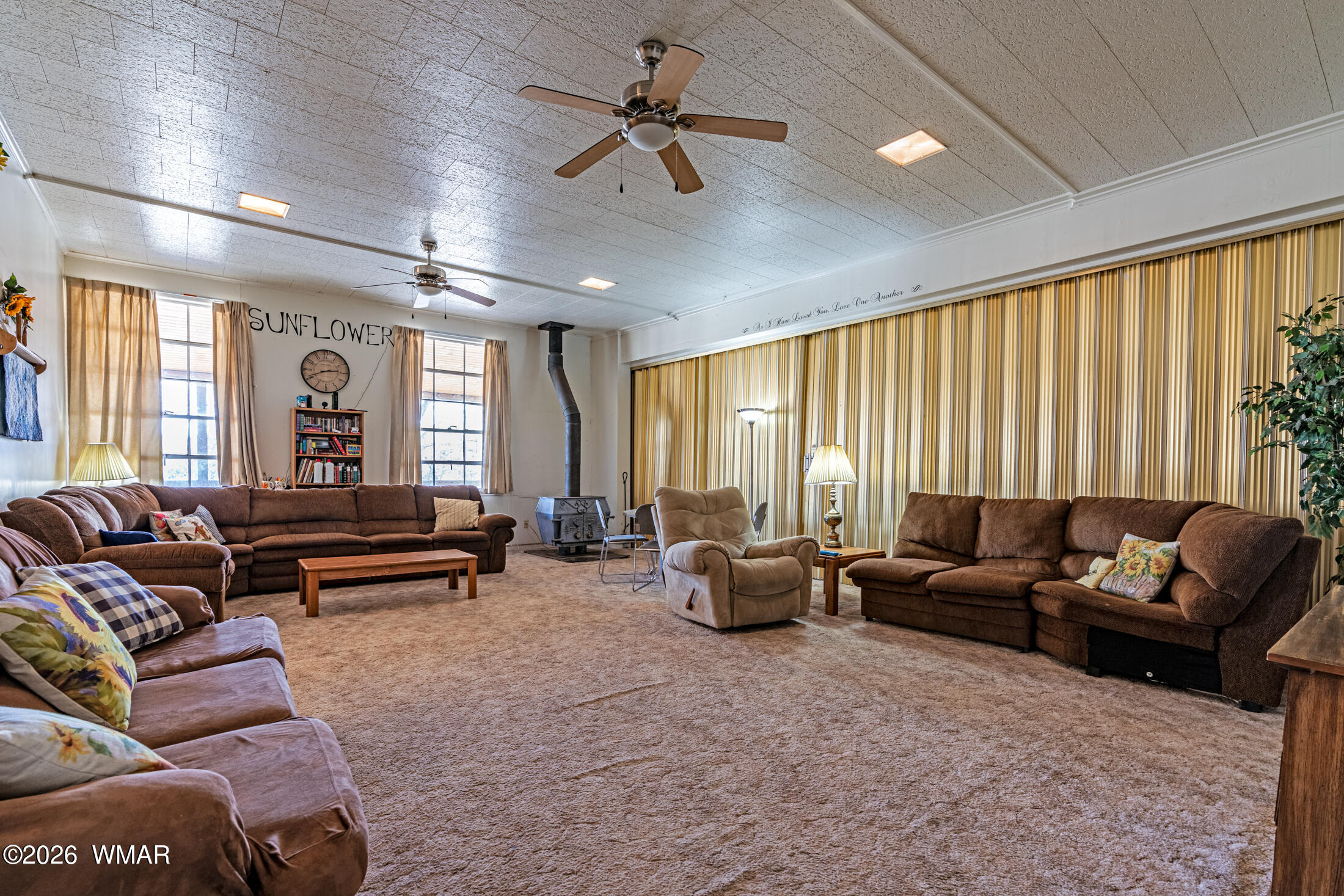 2116 Marble Road Clay Springs, AZ 85923 - Photo 7 of 48 a living room with furniture ceiling fan and a window