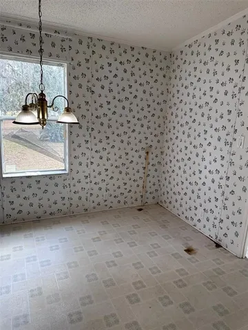a kitchen with stainless steel appliances granite countertop a sink and a stove