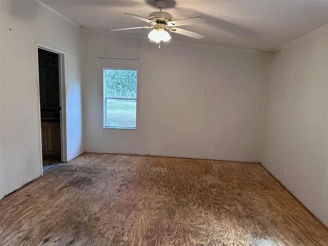 a view of a room with shelf on the wall