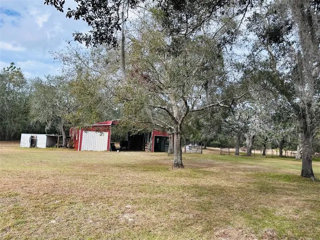 a backyard of a house with lots of green space