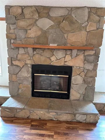 a view of a living room and wooden floor