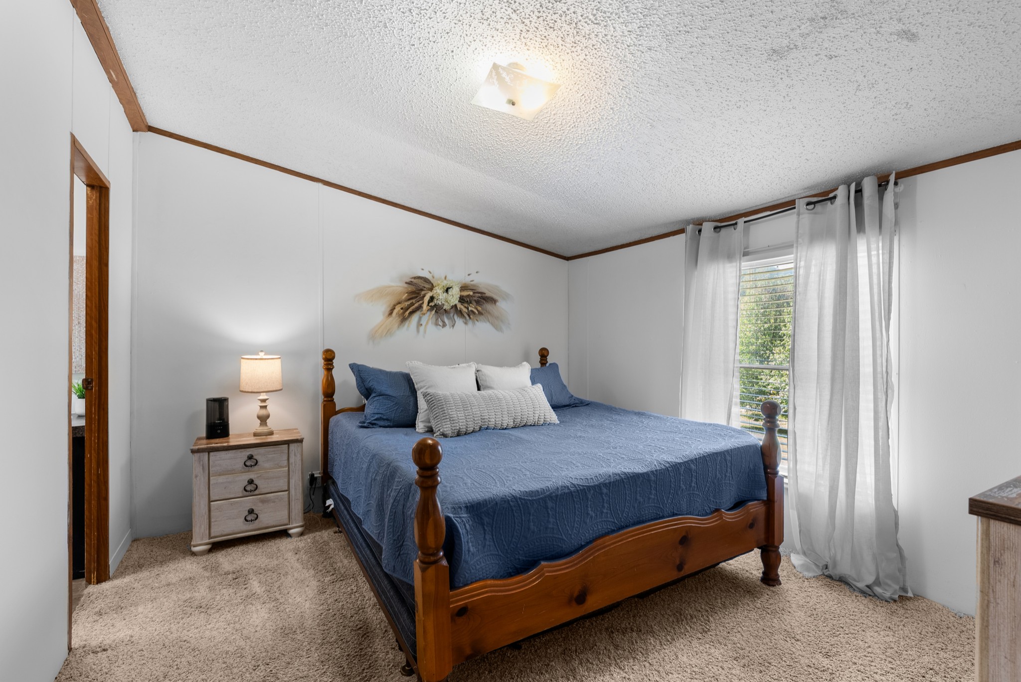 5147 Wiley Hollow Road Culleoka, TN 38451 - Photo 13 of 29 a bedroom with a bed and a cabinets