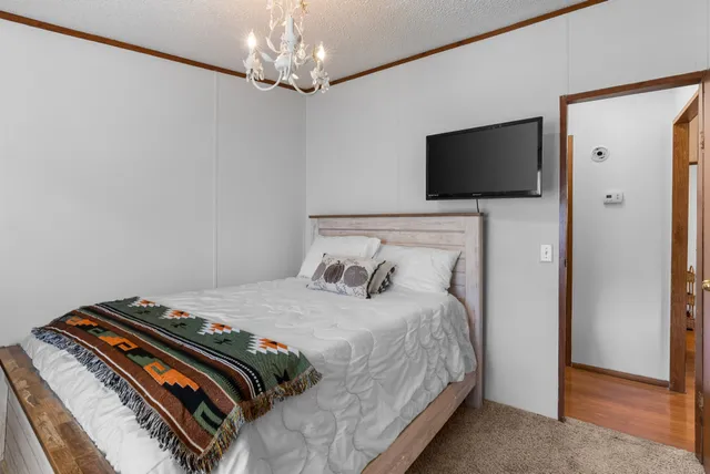 a bedroom with a bed and furniture