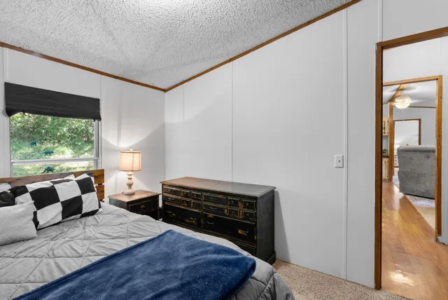 a view of a chair and table in the balcony