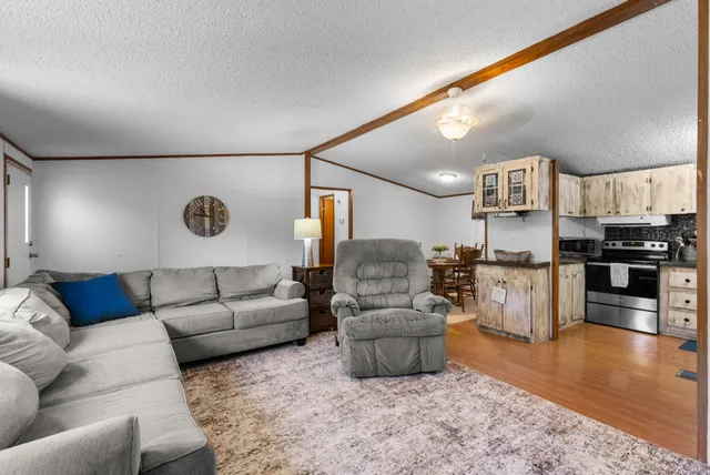 a view of a chairs and table in the balcony
