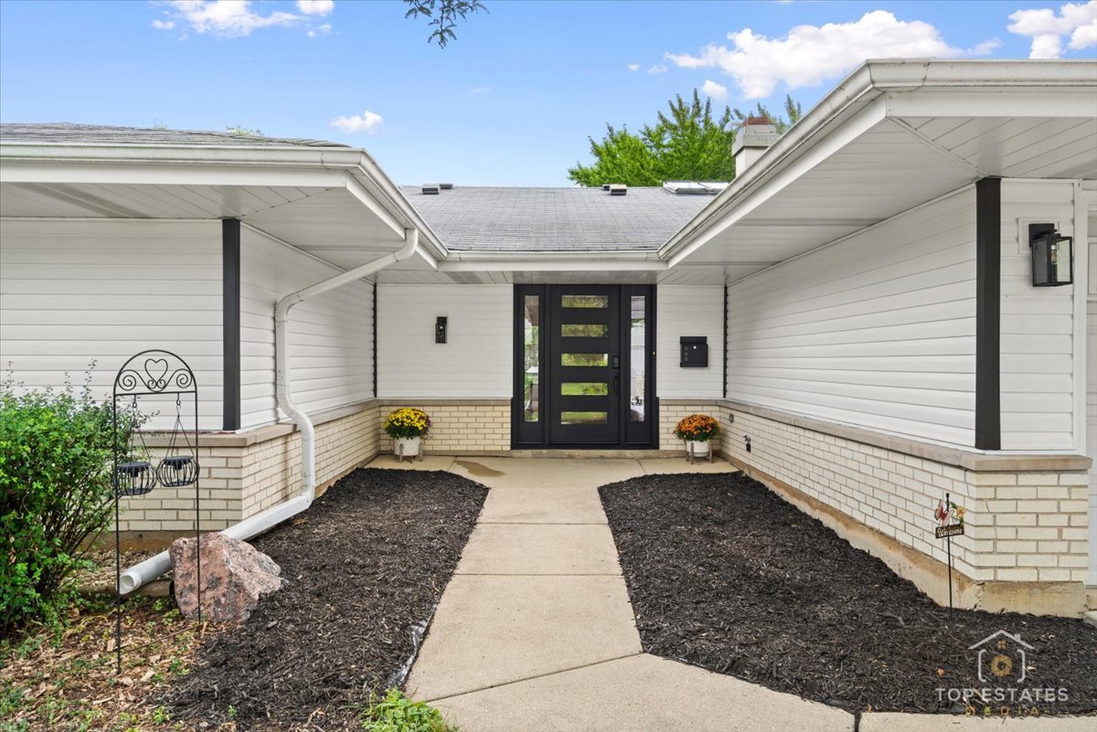 1327 Churchill Road Schaumburg, IL 60169 - Photo 11 of 71 a front view of a house with garden