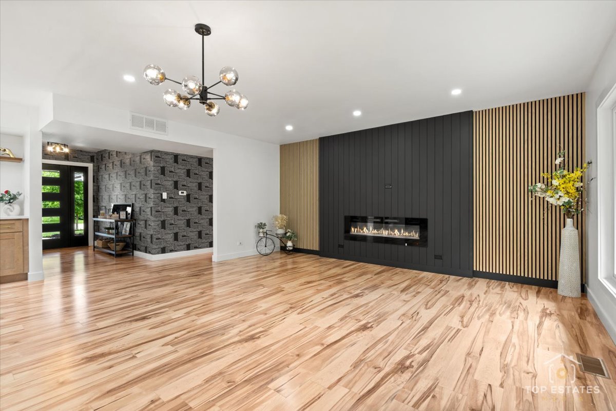 1327 Churchill Road Schaumburg, IL 60169 - Photo 19 of 71 a view of an empty room with a fireplace