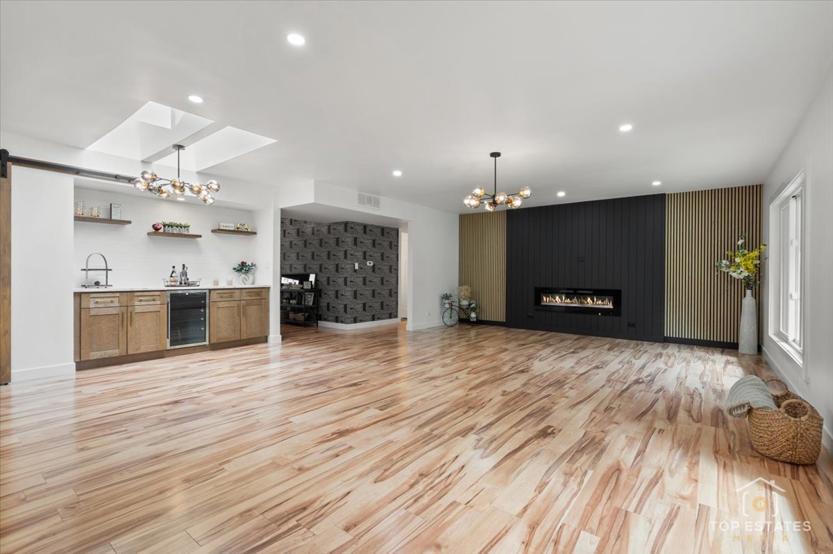 1327 Churchill Road Schaumburg, IL 60169 - Photo 20 of 71 a view of a kitchen with a sink and a fireplace