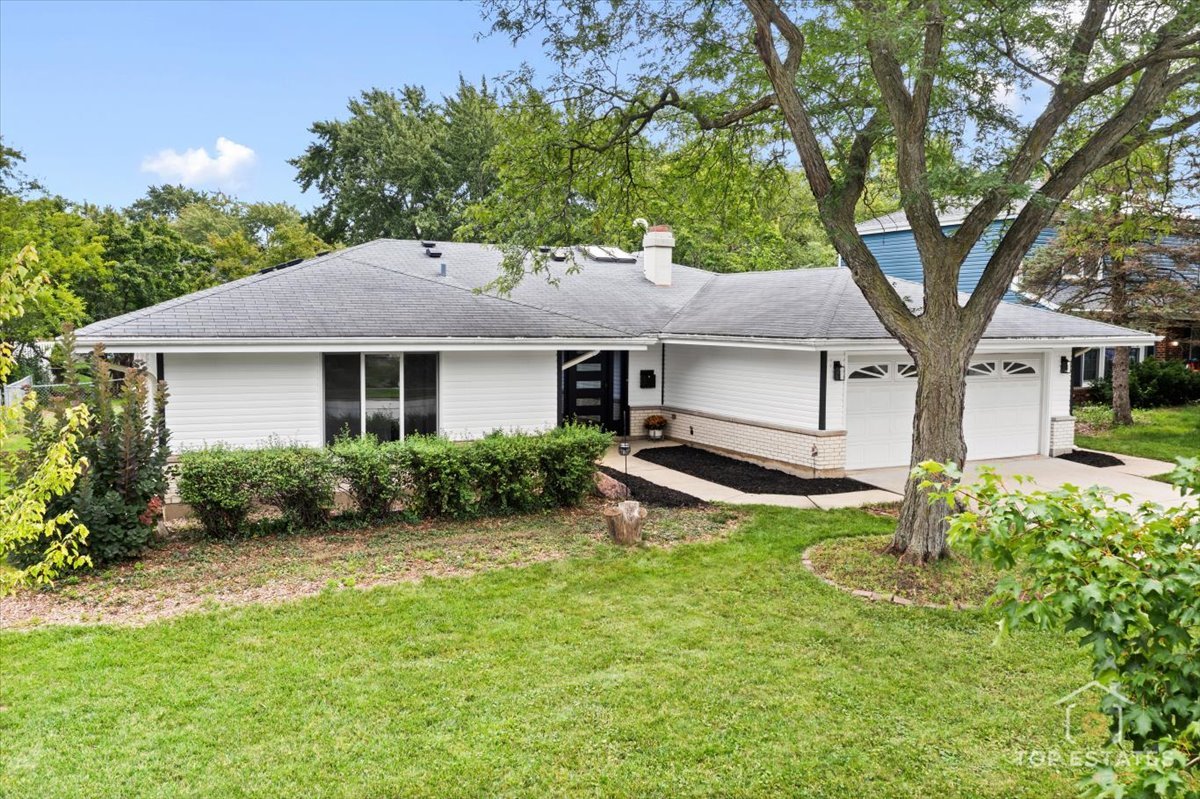 1327 Churchill Road Schaumburg, IL 60169 - Photo 2 of 71 a house that has a tree in it