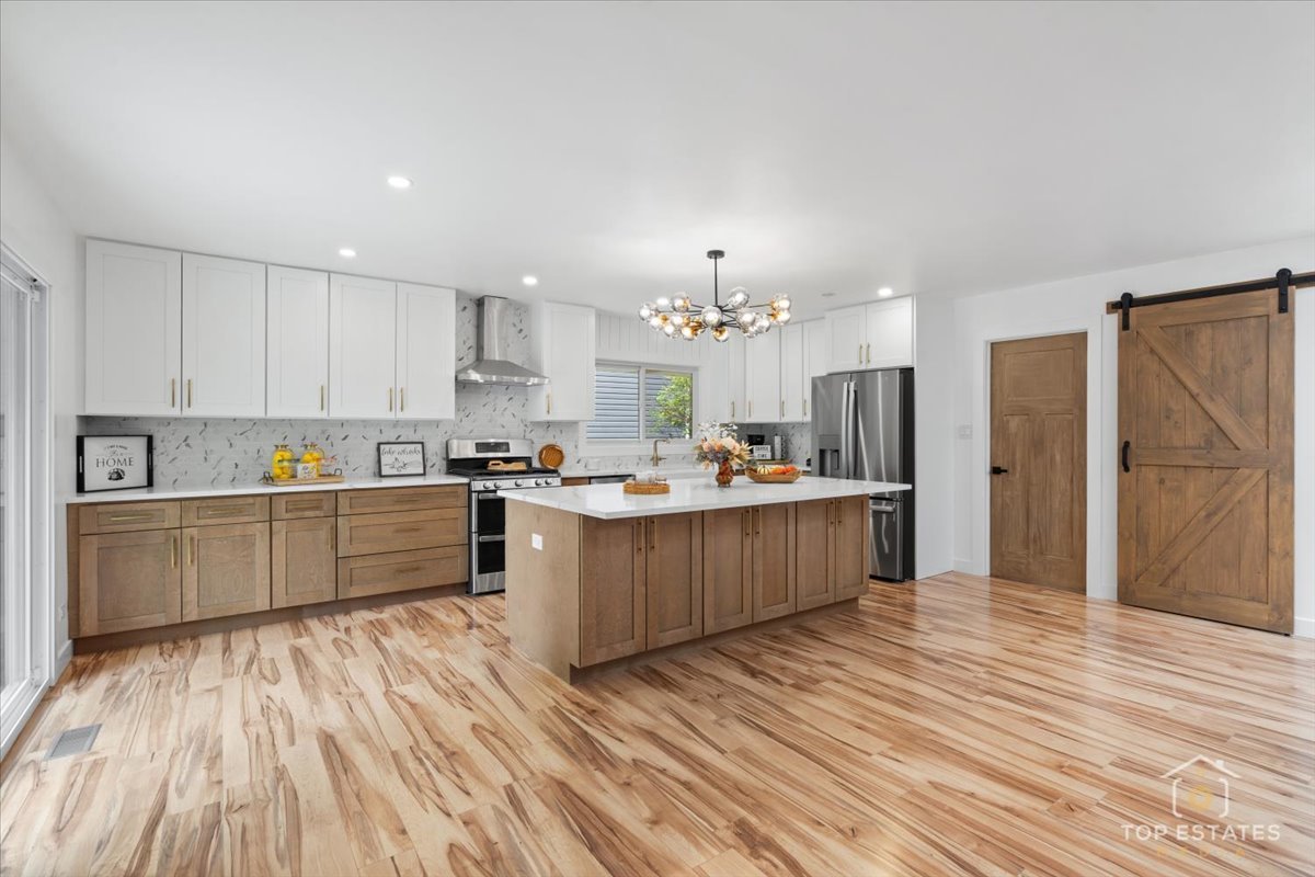 1327 Churchill Road Schaumburg, IL 60169 - Photo 29 of 71 a large kitchen with a lot of counter space and stainless steel appliances