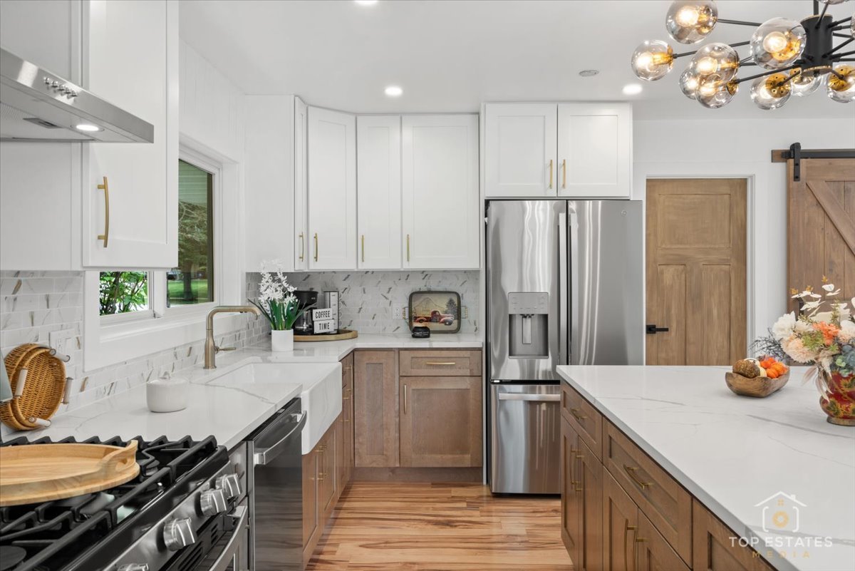 1327 Churchill Road Schaumburg, IL 60169 - Photo 34 of 71 a kitchen with stainless steel appliances granite countertop a sink stove and refrigerator