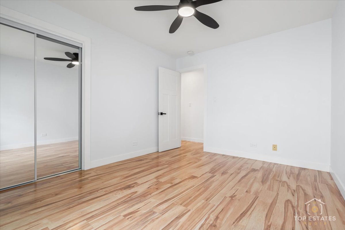 1327 Churchill Road Schaumburg, IL 60169 - Photo 50 of 71 a view of empty room with wooden floor