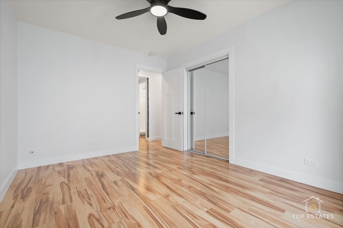 1327 Churchill Road Schaumburg, IL 60169 - Photo 52 of 71 wooden floor in an empty room