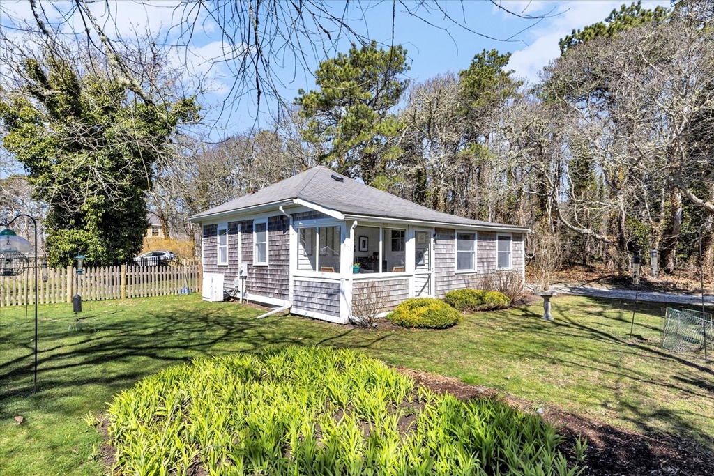9 Jason Lane Harwich, MA 02646 - Photo 1 of 37 a front view of a house with garden