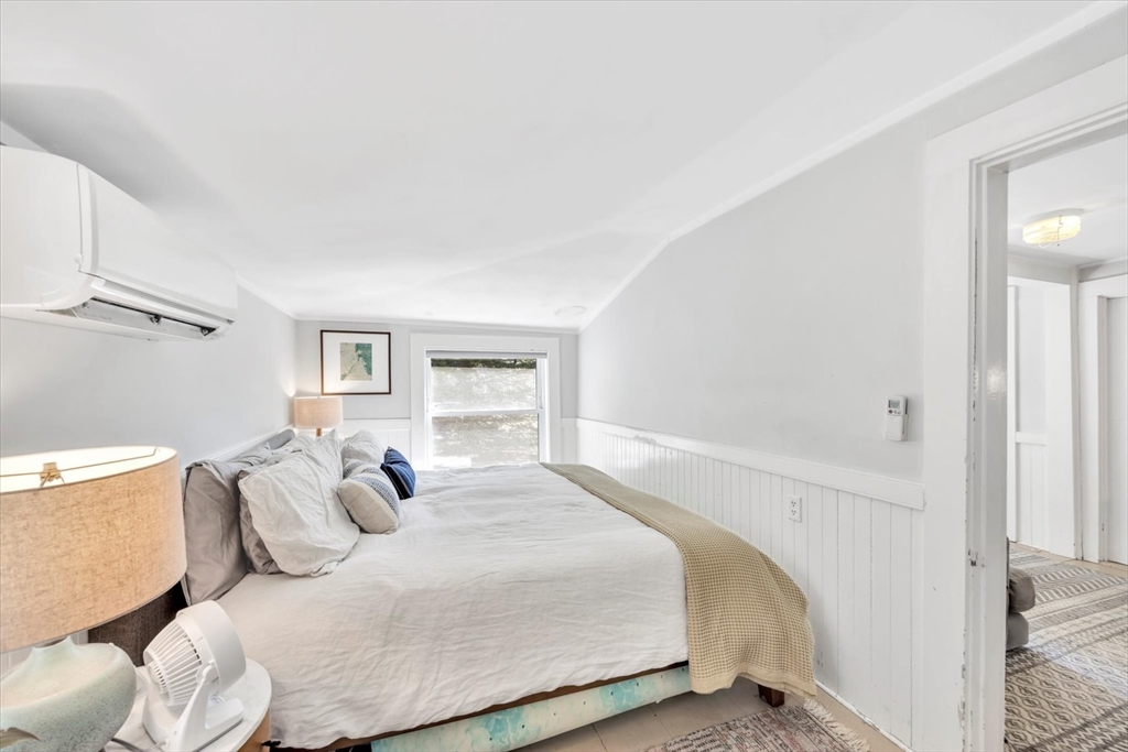9 Jason Lane Harwich, MA 02646 - Photo 23 of 37 a bedroom with a bed and a window