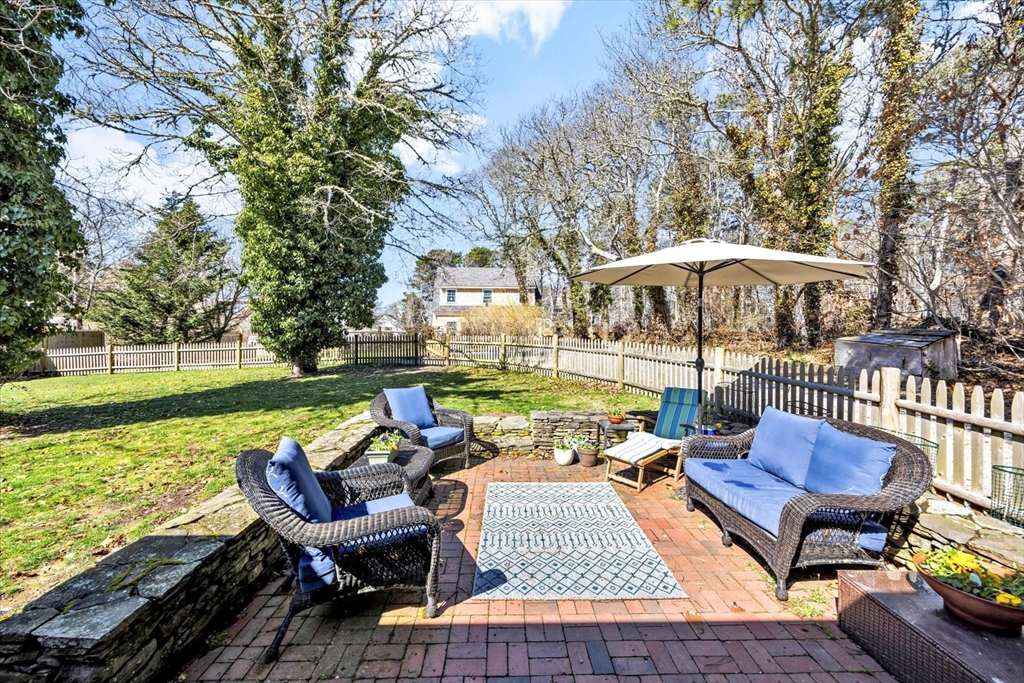 9 Jason Lane Harwich, MA 02646 - Photo 30 of 37 a view of a patio with furniture and a yard