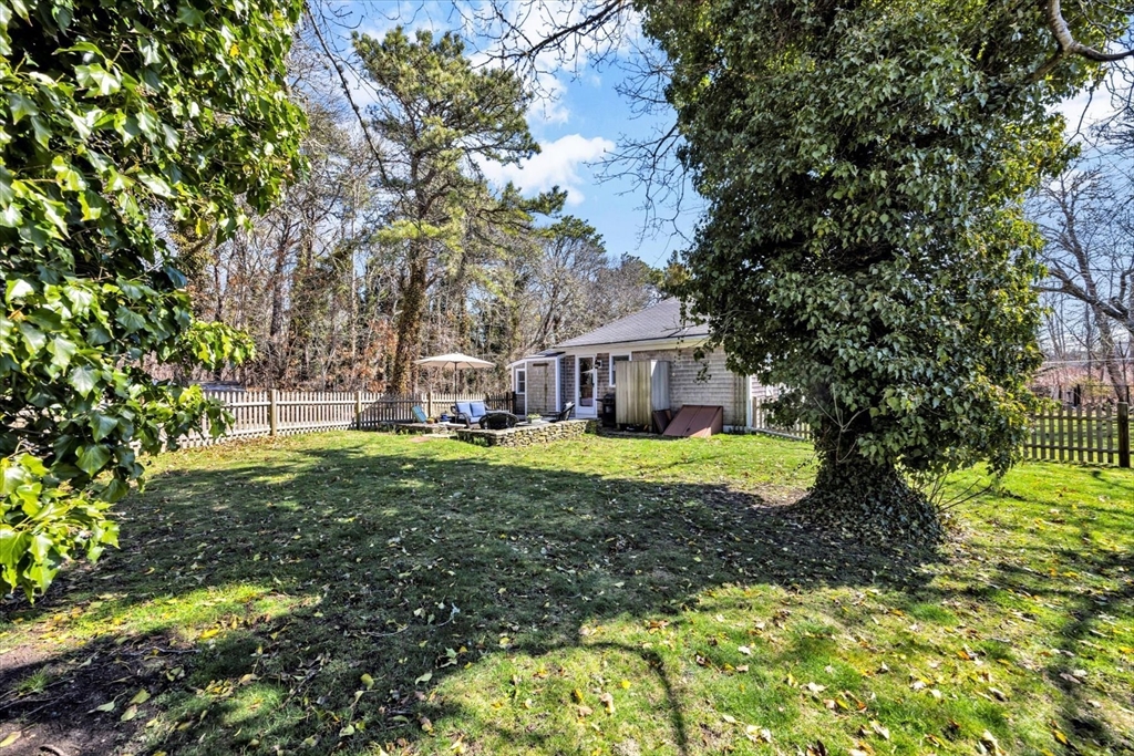 9 Jason Lane Harwich, MA 02646 - Photo 36 of 37 a view of a house with a yard and sitting area