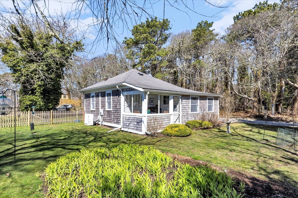 9 Jason Lane Harwich, MA 02646 - Photo 37 of 37 a front view of a house with garden