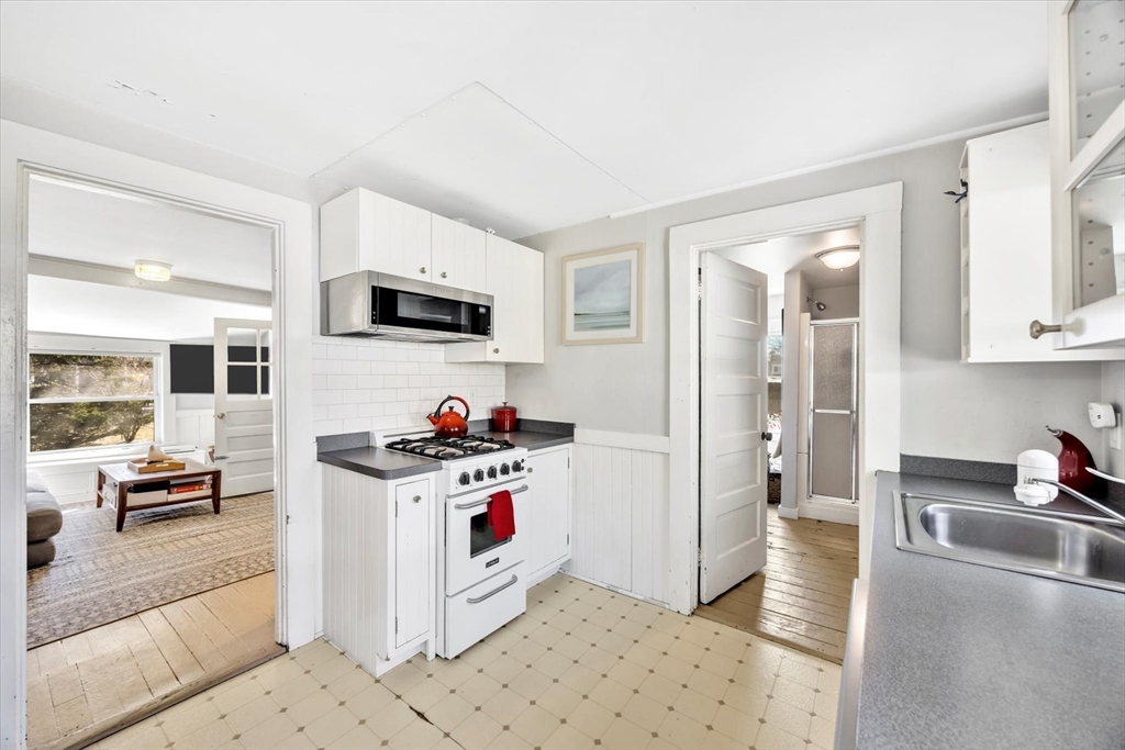 9 Jason Lane Harwich, MA 02646 - Photo 8 of 37 a kitchen with stainless steel appliances kitchen island granite countertop a stove and a sink