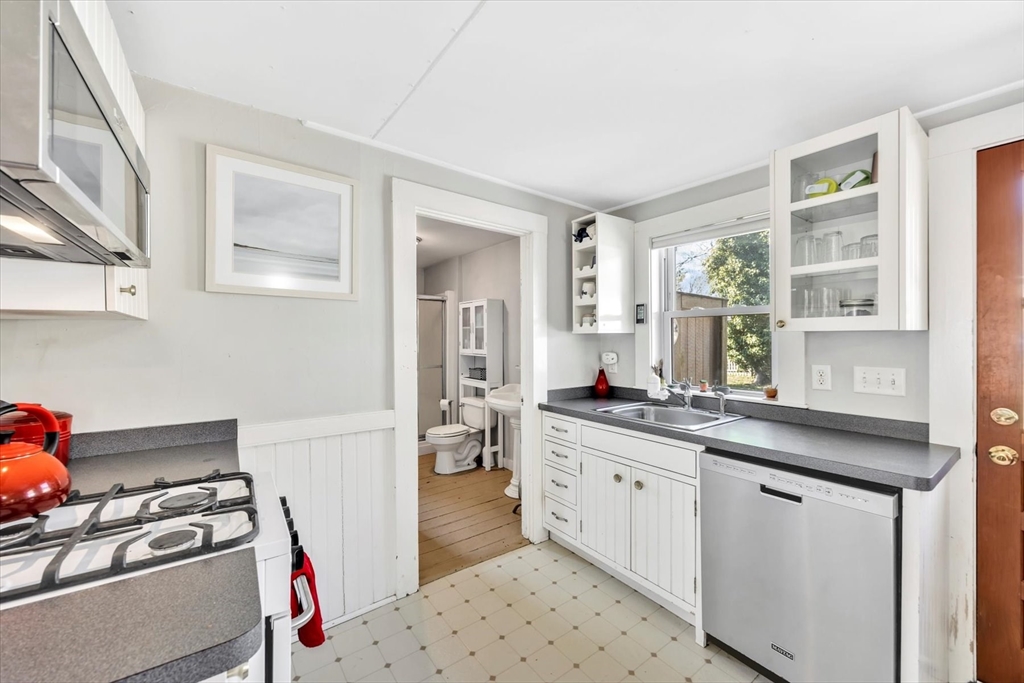 9 Jason Lane Harwich, MA 02646 - Photo 9 of 37 a kitchen with stainless steel appliances a sink stove and cabinets